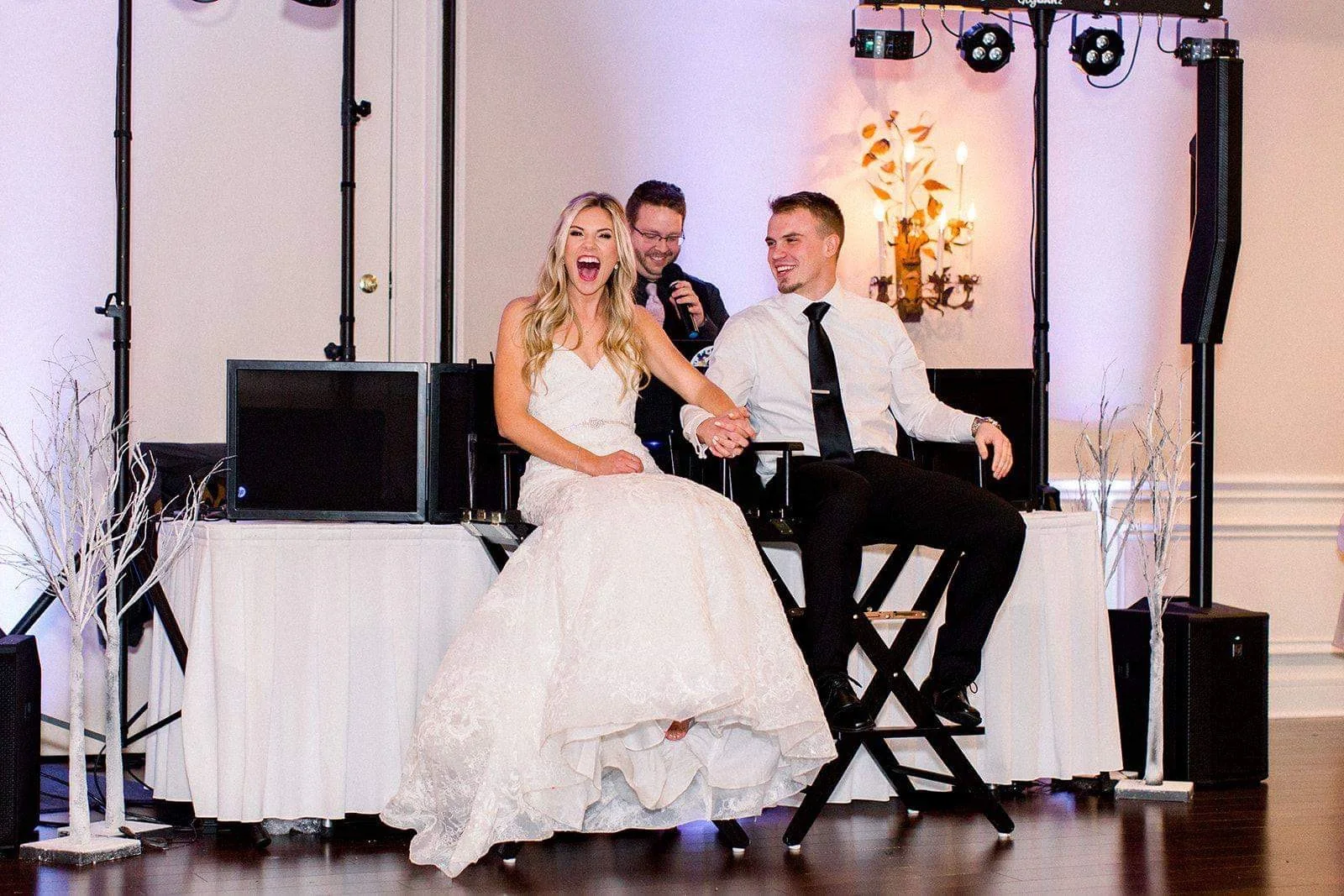 Large group of wedding guests celebrating on the dance floor