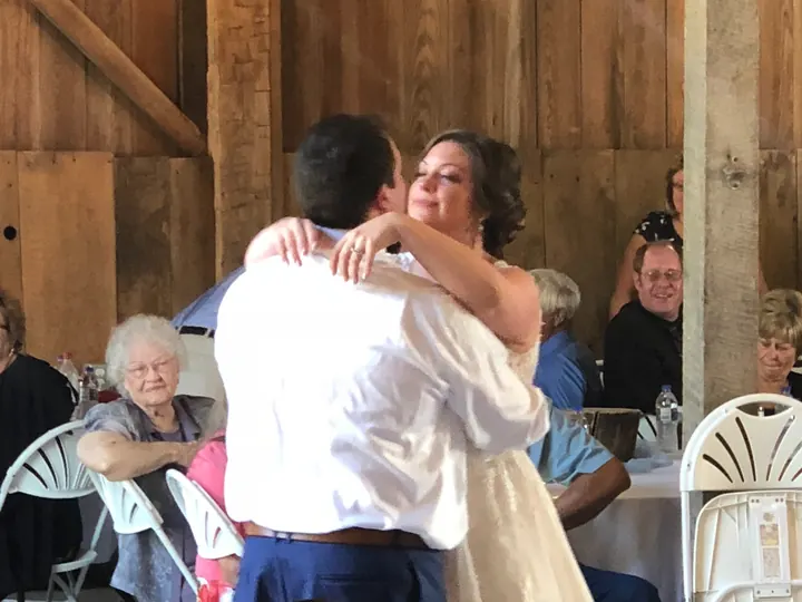 Bride dancing at a rustic wedding