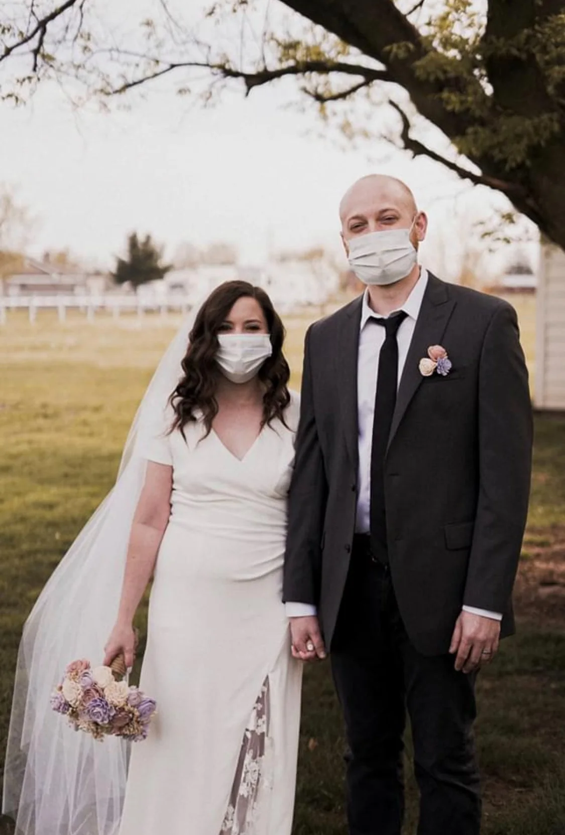 Bride and groom standing together after their wedding ceremony